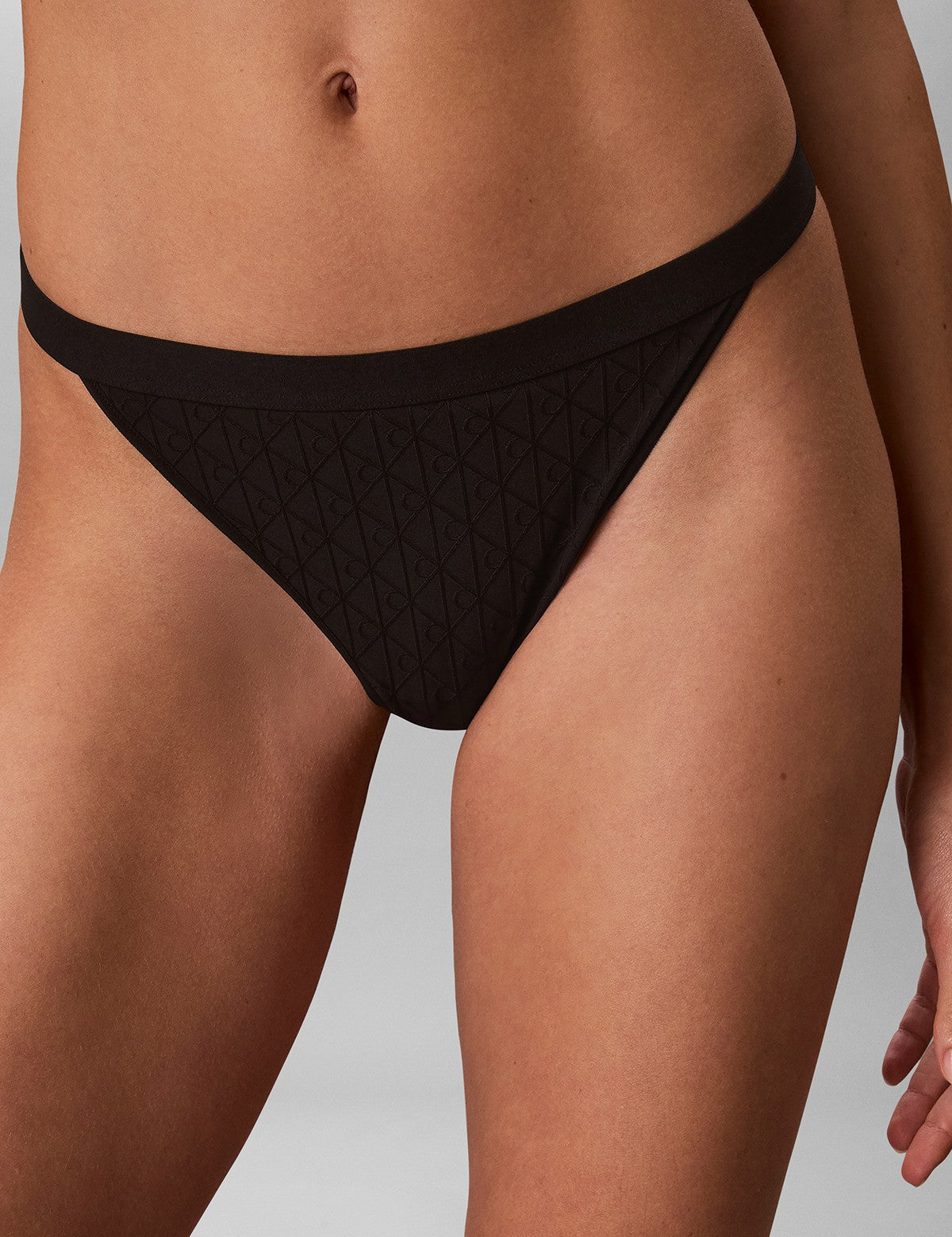 Calvin Klein Women Embossed Emblem String Tanga